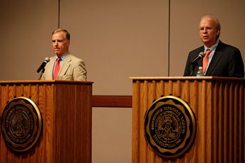 Howard Dean and Karl Rove at a news conference